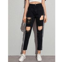 Ripped cut out tape side jeans l