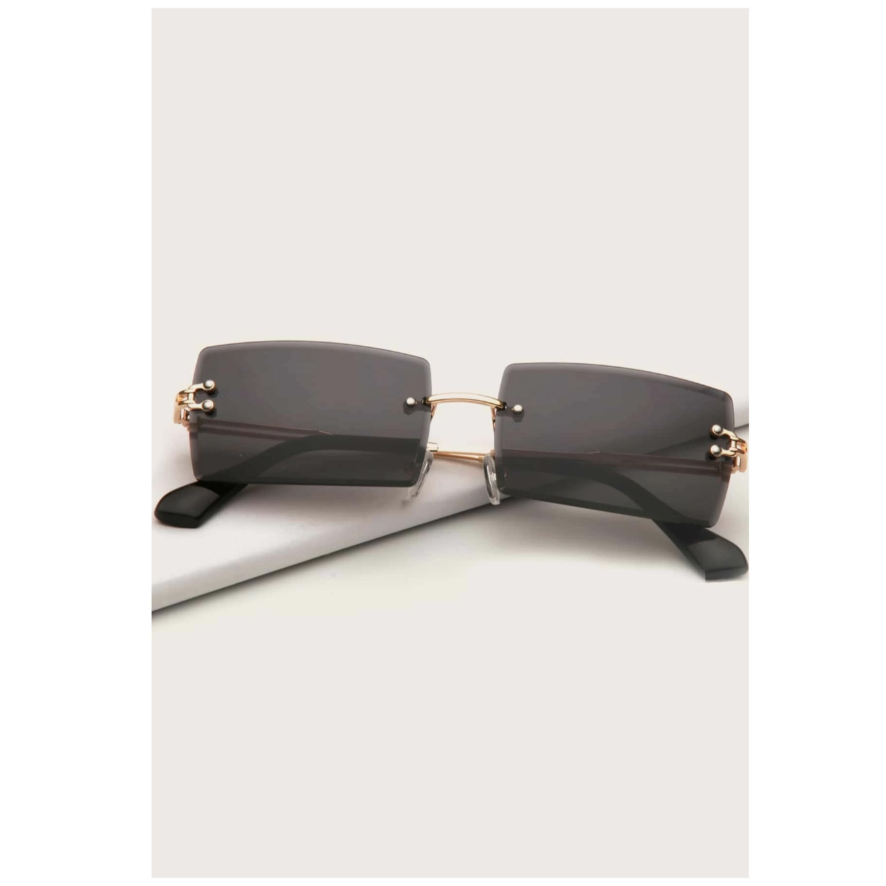 Rimless sunglasses with case golden frame with grey colour